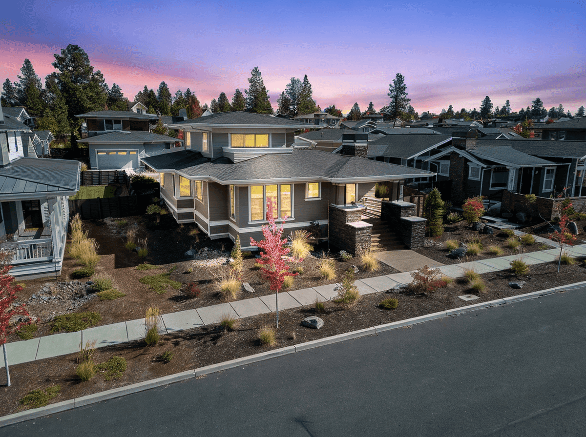 Virtual Twilight Aerial front view of luxury home in Northwest Crossing Bend Oregon captured by professional real estate photographer